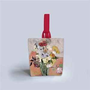 Detail of Van Gogh Roses art print on canvas handbag with vibrant red handle design
