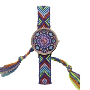 Bohemian woven strap watch for women featuring a colorful mandala dial and gold metal case