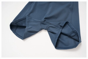 Close-up of diamond crotch gusset and flatlock stitching on navy yoga shorts