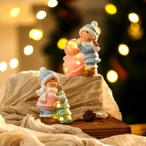Detail of ceramic Christmas night light with warm LED glow and knit texture finish