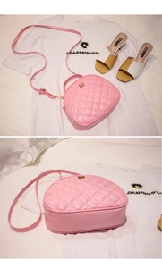 Pink PU leather shell crossbody bag with quilted diamond pattern and gold hardware