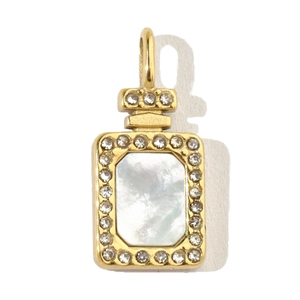 Detailed macro shot of a gold perfume bottle pendant with white mother of pearl and crystals