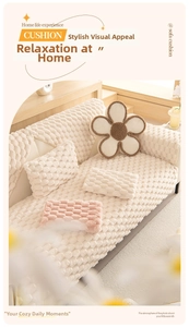 Macro detail of thick cream plush sofa cover with 3D bubble texture and flower pillow
