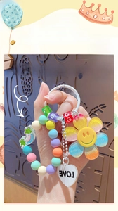 Elastic beaded charm featuring sunflower and LOVE tag for bags and keychains