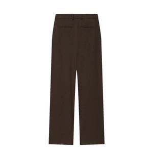 Detail of high-waist wide-leg trousers in dark brown with back welt pockets and clean cut