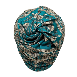Detail of teal paisley pattern and twist knot design on the bohemian turban hat