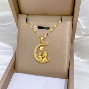 Golden moon pendant necklace with heart-shaped engraving for mothers in a jewelry gift box