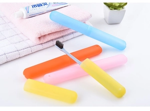 Detail of portable ventilated toothbrush travel cases in blue, pink, and orange colors