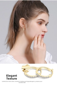 Detailed view of S925 sterling silver gold plated hoop earrings with sparkling cubic zirconia