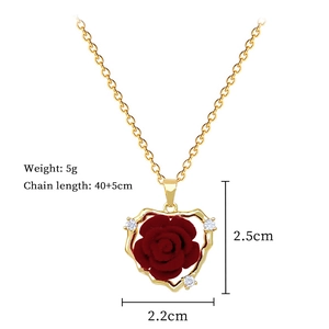 Detailed specs of heart pendant with red rose and crystals, size 2.5x2.2cm, weight 5g