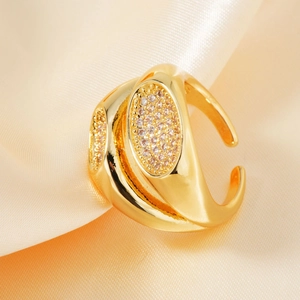 Elegant gold double-layered open ring with micro-paved oval zircon on champagne silk background