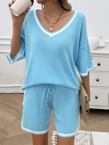 Sky blue knit lounge set featuring V-neck short sleeve top and drawstring shorts with stripes