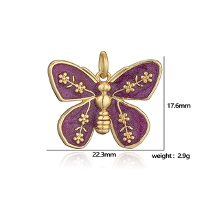 Golden butterfly pendant with purple enamel and dimensions 17.6mm by 22.3mm