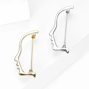 Minimalist gold and silver abstract face brooches on creative artistic metal silhouettes