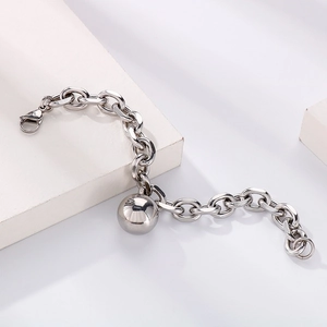 Chunky stainless steel chain bracelet featuring a large polished hollow metal ball pendant