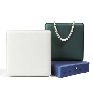 Elegant leather crown jewelry box for pearl necklaces in white green and navy blue