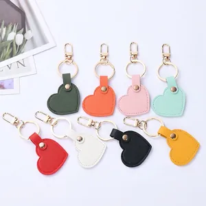 Handcrafted heart-shaped leather keychains in multiple colors with golden metal rings