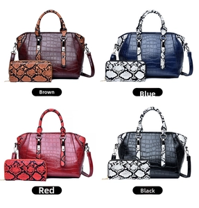 Detail of faux leather handbag sets in brown, blue, red, and black with crocodile pattern