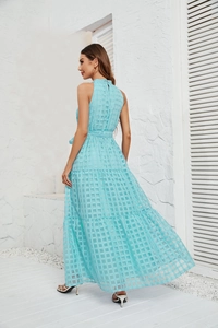 Detail of sky blue halter dress showing tiered chiffon layers and square texture