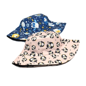 Reversible bucket hat set with navy owl print and pink penguin cartoon graphics for sun protection