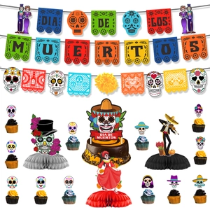 Close-up of Day of the Dead party decor set with colorful banners and paper centerpieces