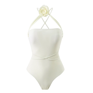 Detail of white one-piece swimsuit with 3D floral accent and wrap-around waist straps