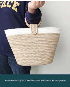 Close-up detail of beige and white woven cotton rope tote bag with round handles