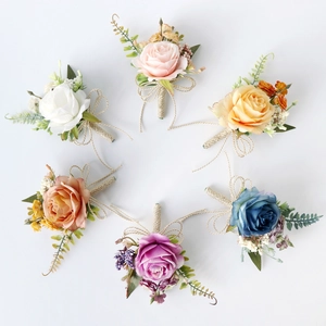 Artistic artificial rose boutonniere set in six vintage colors for wedding and ceremonies