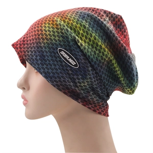 Detail of multi-color gradient knit beanie with honeycomb mesh texture and side logo