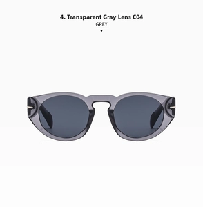 Detail view of transparent grey sunglasses with dark grey lenses and gold rivets
