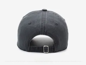 Detail view of washed cotton baseball cap featuring an adjustable silver metal buckle