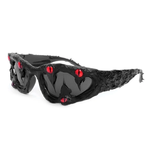 Gothic street style sunglasses with black sculpted frame and red eyeball decorations