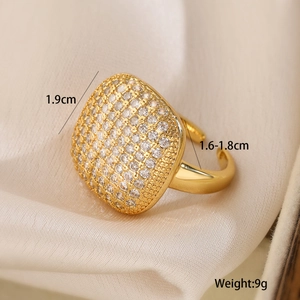 Detail view of golden heart geometric zircon ring showing 1.9cm diameter on silk