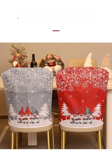 Detailed view of Christmas chair covers with gnome and snowflake prints in red and grey