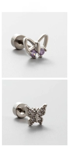 Macro detail of silver butterfly earrings with purple gems and pavé zircon stones