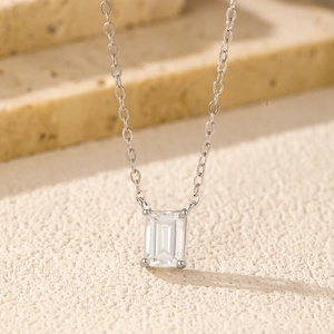 1 carat emerald cut moissanite pendant on silver chain for an elegant aesthetic