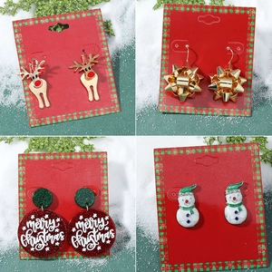 Christmas earrings set featuring elk, snowman, and gold bow designs for holiday parties