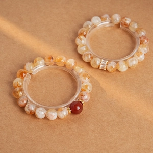 Détails de bracelets en perles de cristal jaune avec accent rouge et intercalaires en métal