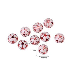 Macro shot of 11.5mm white soccer style acrylic beads with red engraved patterns