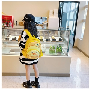 Detail view of yellow cartoon duck backpack with mesh pocket and mesh side storage