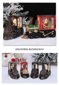 Macro shot of vintage Christmas train lantern featuring illuminated Santa and snowman scenes