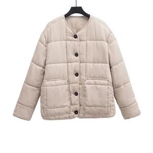 Beige quilted short jacket with round neck and black buttons on a hanger
