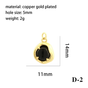 Detail view of black gemstone pendant with 18K gold plated copper specifications and size