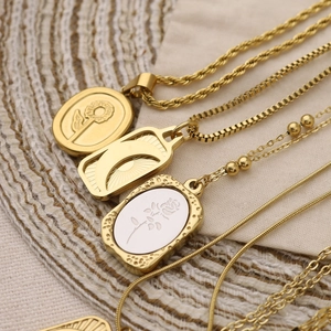 Vintage gold plated stainless steel necklaces with floral and celestial relief pendants