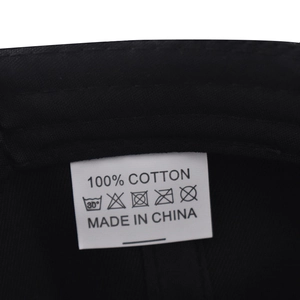 Detail view of the 100% cotton fabric and wash care label inside this hip hop baseball cap