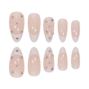 French white tip almond press-on nails with rhinestone accents on nude pink base