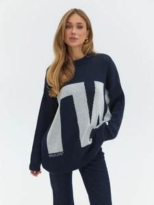 Navy blue oversized knit sweater featuring white letter jacquard and round neckline