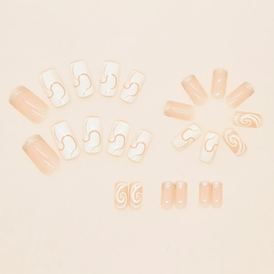 French champagne glitter press-on nails with cream white swirl patterns in 24 pieces