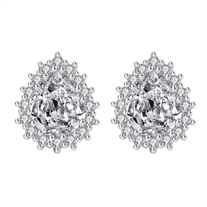 Macro view of pear-cut moissanite stud earrings with surrounding diamond halo