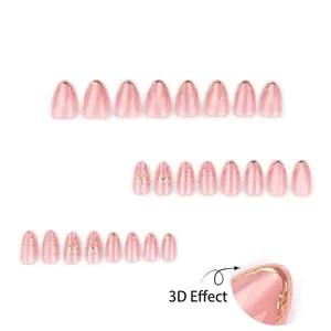 Faux ongles amande rose œil-de-chat avec nœuds dorés 3D et décorations en relief